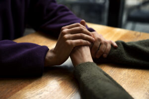 hands holding each other support