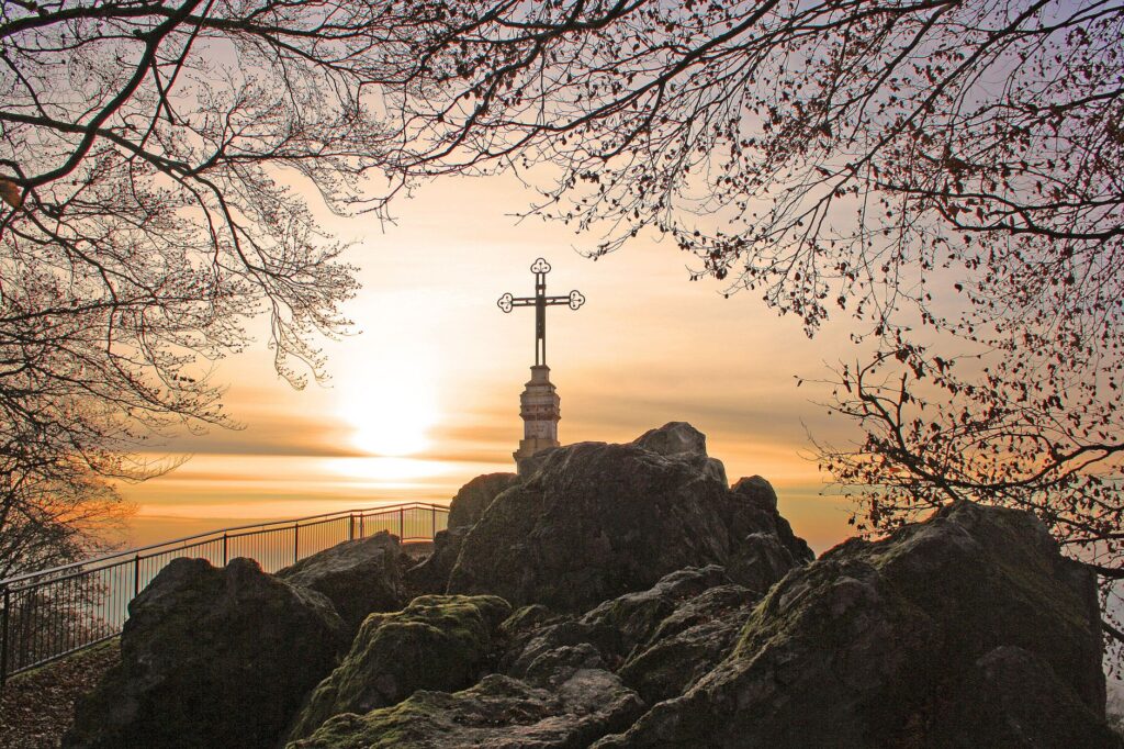A breathtaking sunrise over a landscape, representing new beginnings and hope in faith
