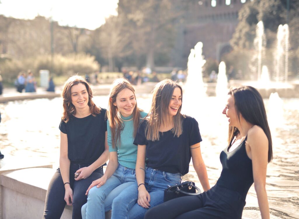 A group of friends laughing together, representing the joy of healthy and respectful friendships