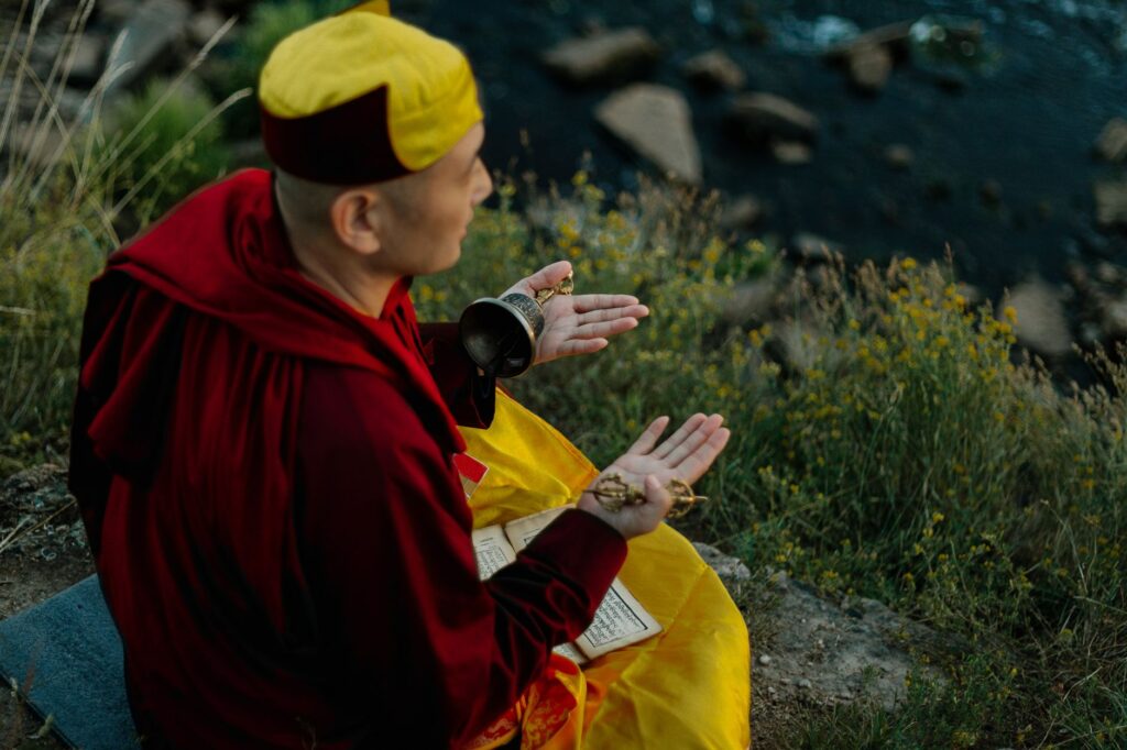 A man praying outdoors, illustrating the connection between nature and spiritual reflection in the life of faith