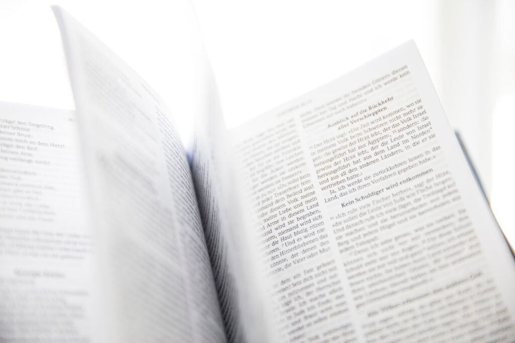 A serene scene of an open Bible bathed in morning light, symbolizing the guidance of Scripture in our faith journey