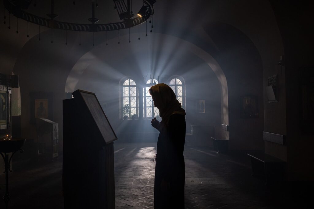 A woman in prayer, illustrating the importance of seeking God in faith