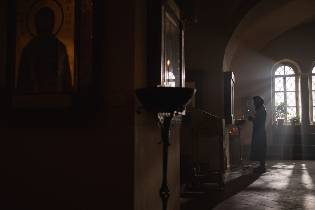 A woman in prayer, seeking guidance and strength, reflecting the deep commitment of true faith