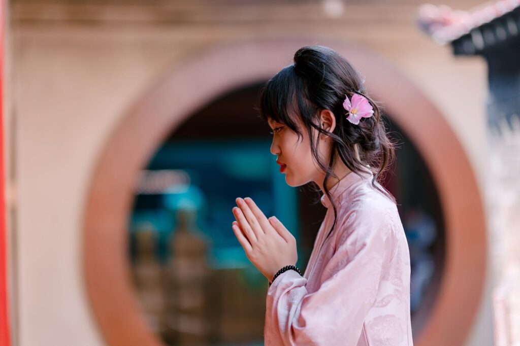 A woman praying by the window illustrates the personal connection with God through prayer