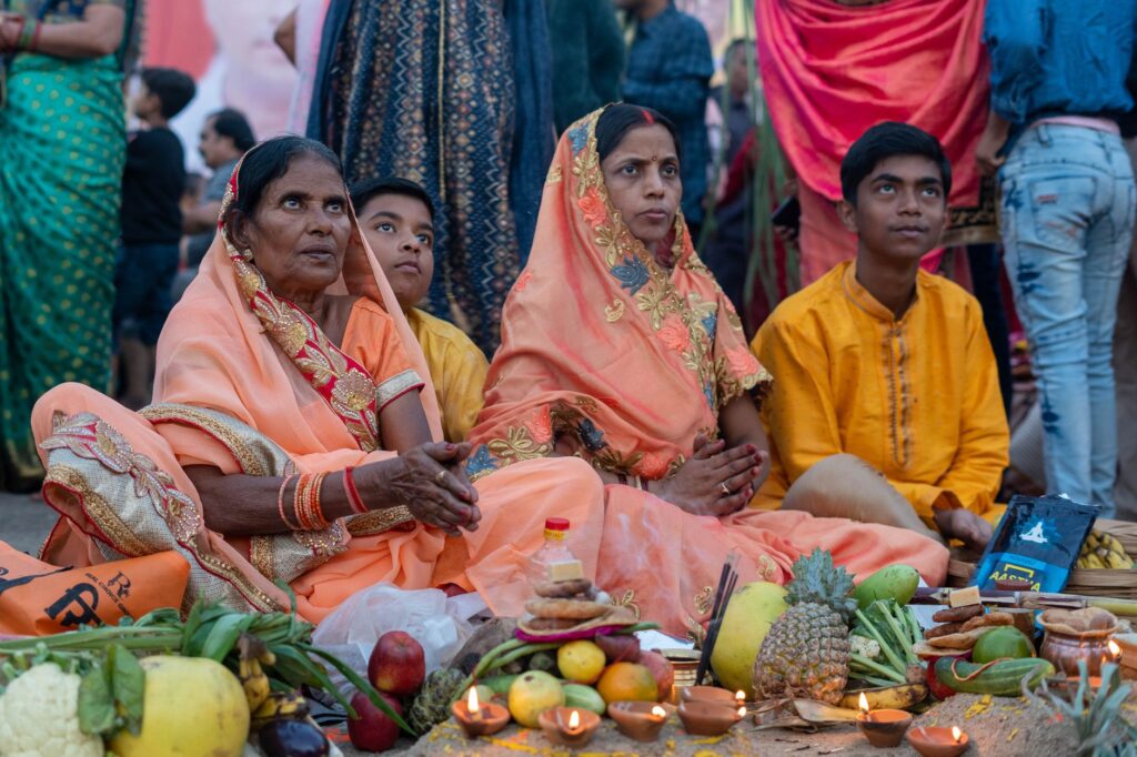 Family celebrates Indian festival with offerings and traditional attire